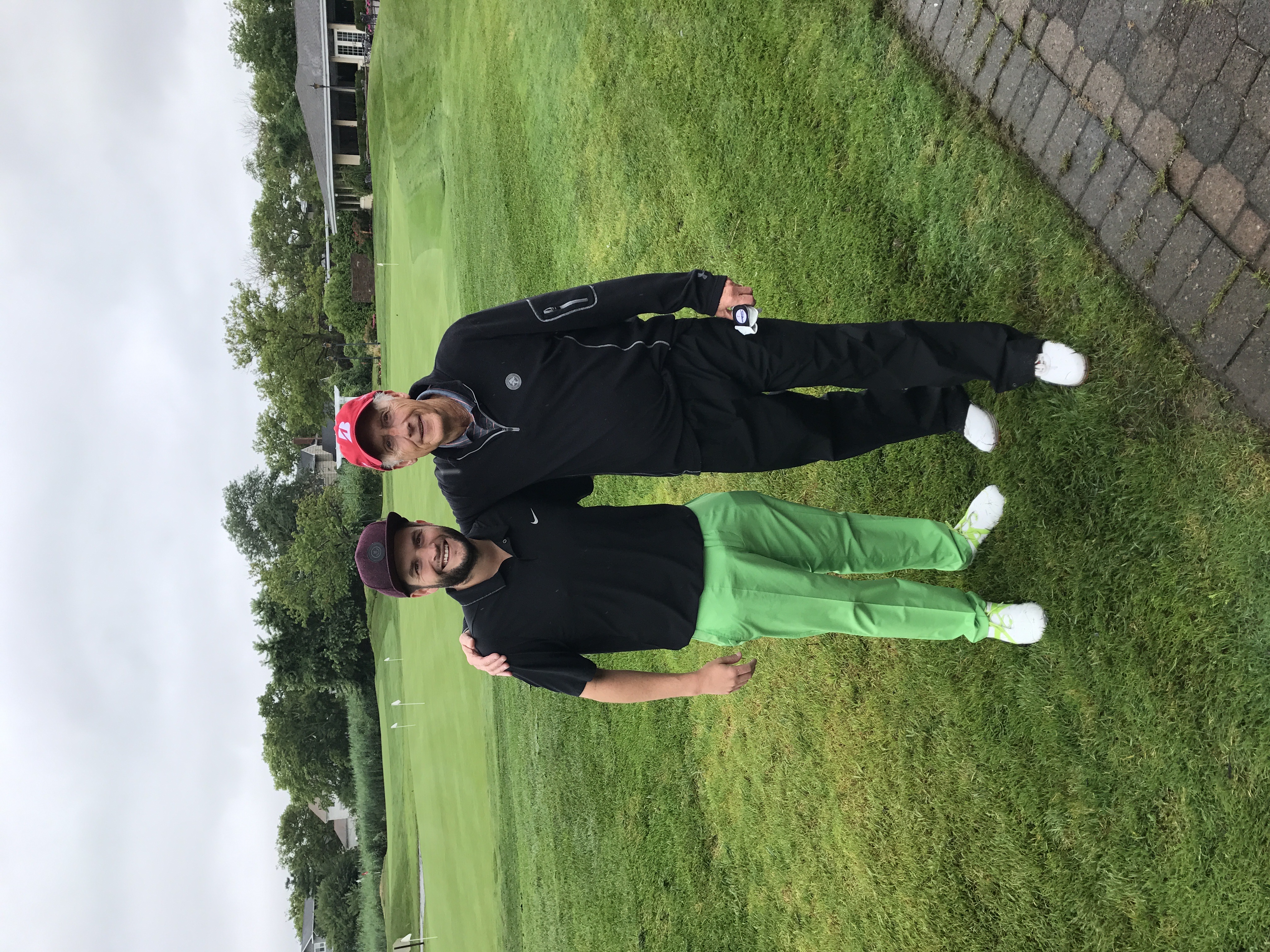 Bennett Fink and his dad on the golf course